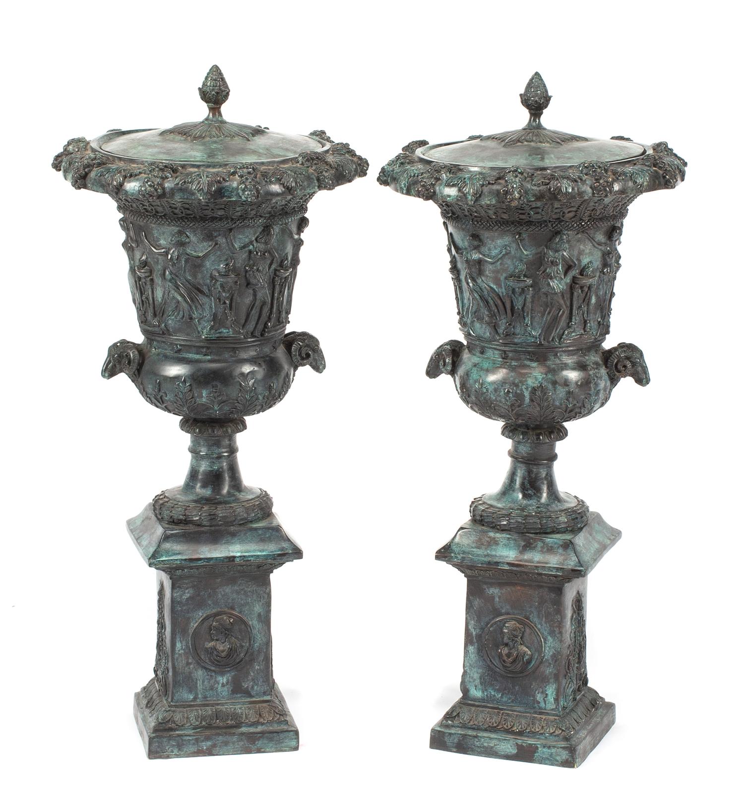 A Pair of Pompeiian Style Patinated Bronze Covered Urns Height 31 1/2 inches.