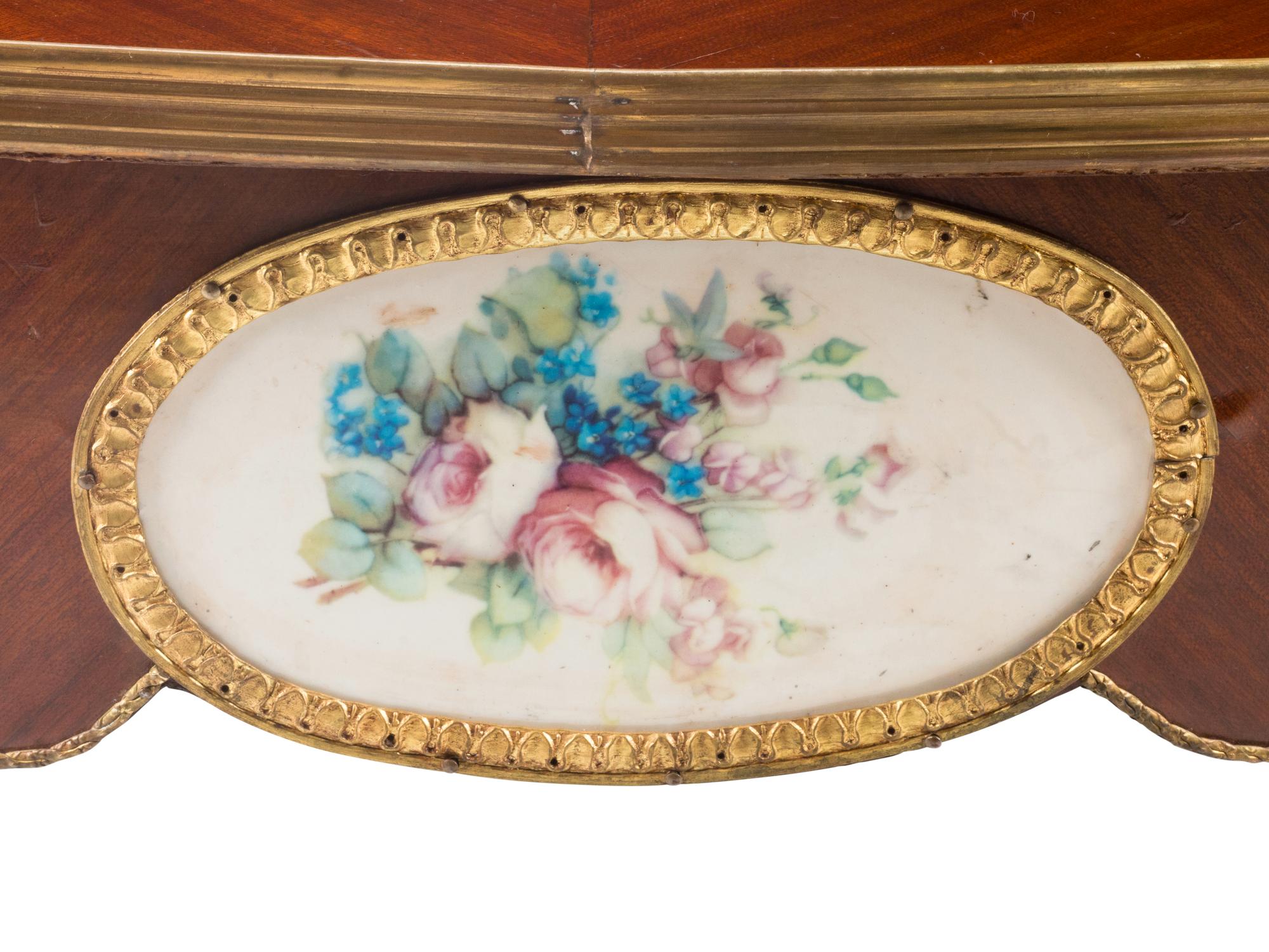 A Louis XV Style Gilt Bronze and Porcelain Mounted Low Table