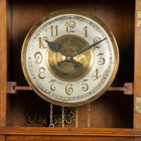 A Gustav Becker Oak Tall Case Clock