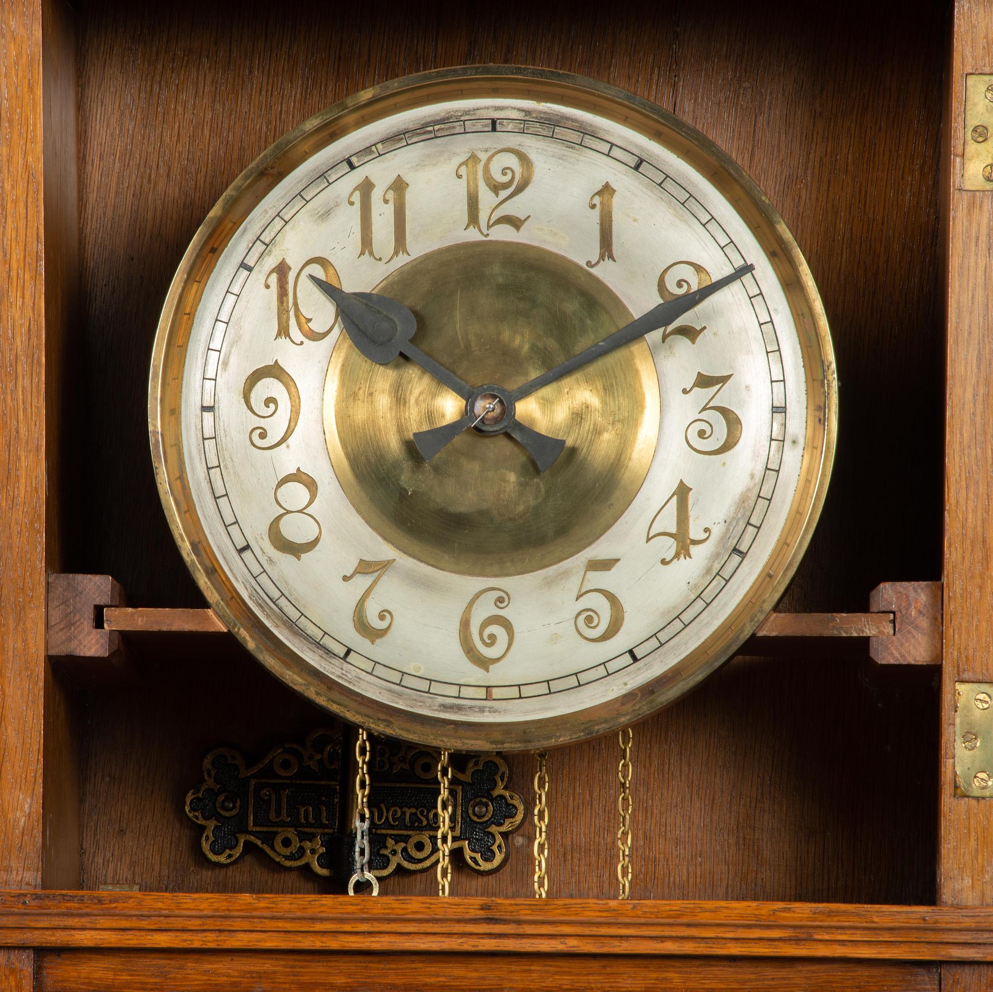 A Gustav Becker Oak Tall Case Clock