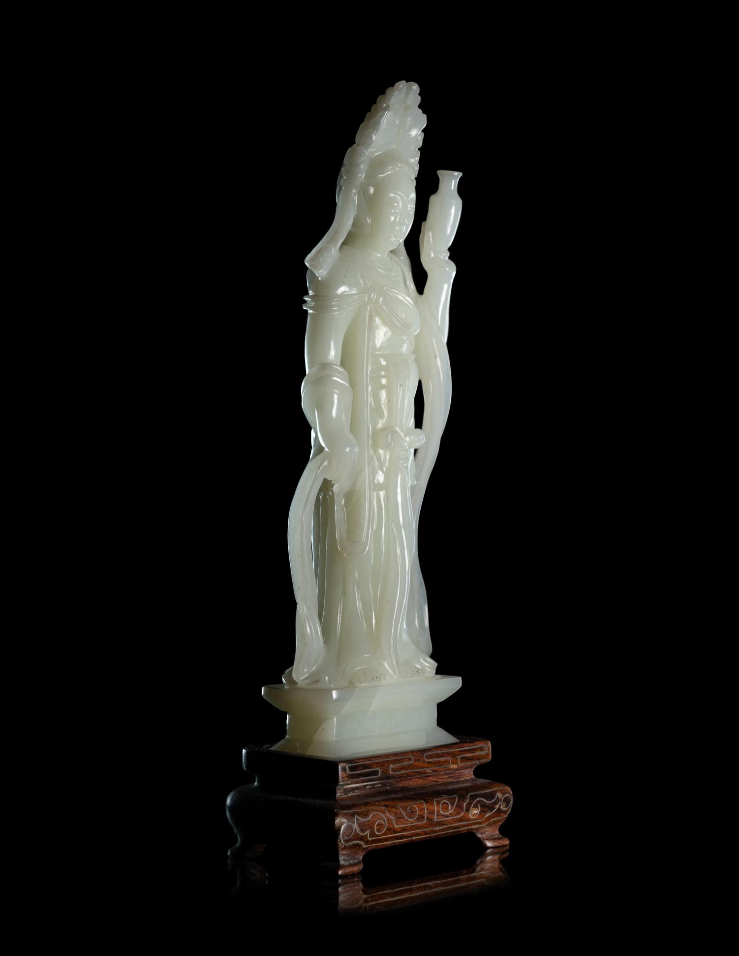 A Pale Celadon Jade Figure of Standing Guanyin