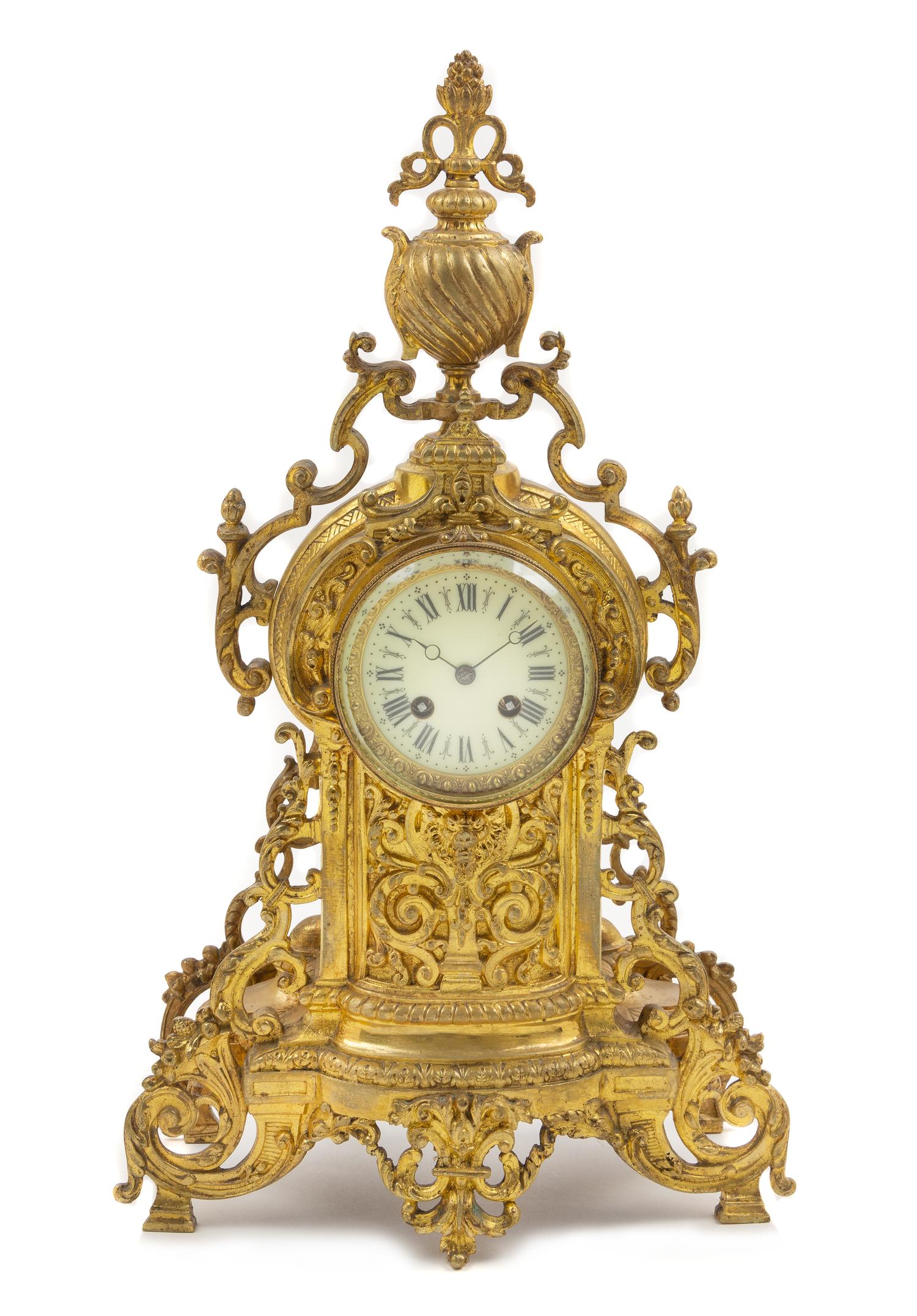 A French Neoclassical Gilt Metal Mantel Clock Height 20 3/4 x width 11 1/2 x depth 4 inches. — LATE 19TH CENTURY