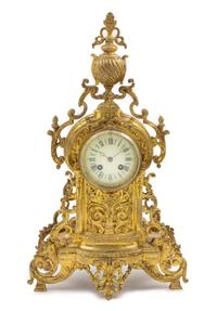 A French Neoclassical Gilt Metal Mantel Clock Height 20 3/4 x width 11 1/2 x depth 4 inches. — LATE 19TH CENTURY