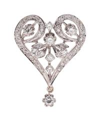 A 14 Karat White Gold and Diamond Pendant/Brooch,