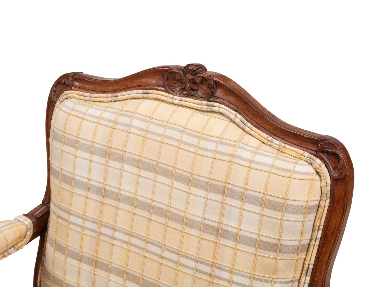 A Pair of Louis XV Provincial Walnut Fauteuils