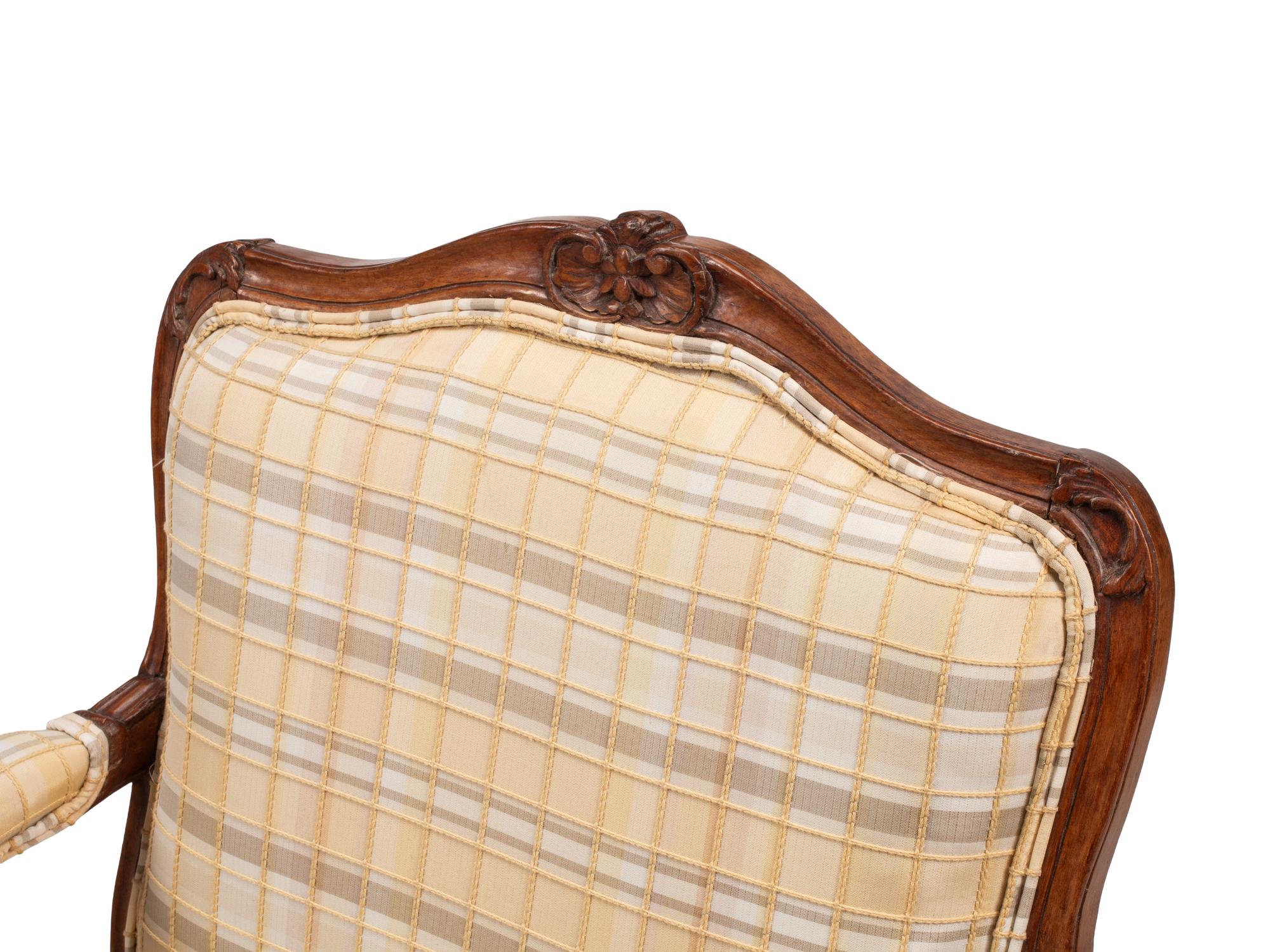 A Pair of Louis XV Provincial Walnut Fauteuils