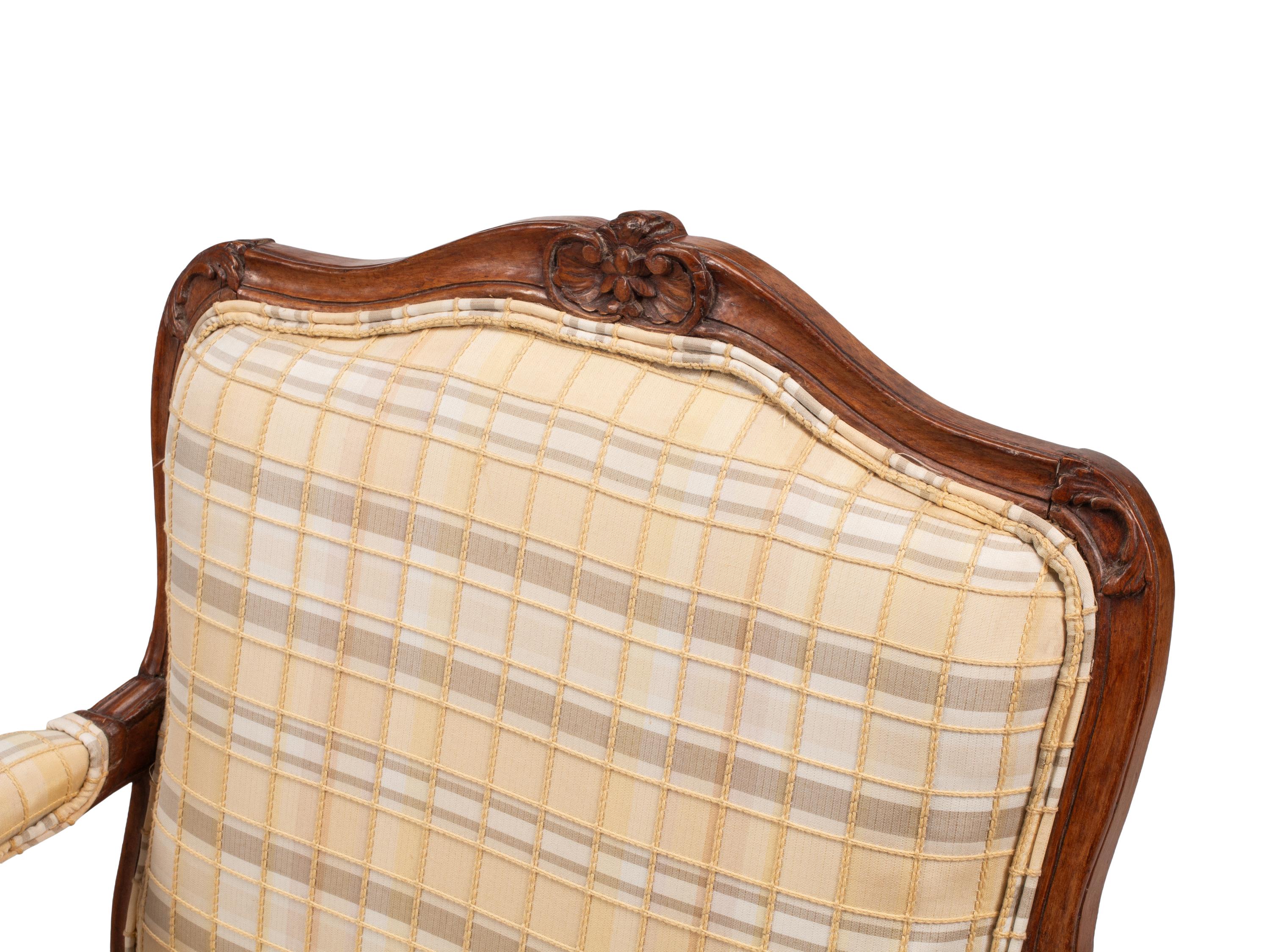 A Pair of Louis XV Provincial Walnut Fauteuils