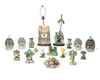 A large collection of seventeen Staffordshire figural groups and floral-form spill vases, late 18th and 19th century