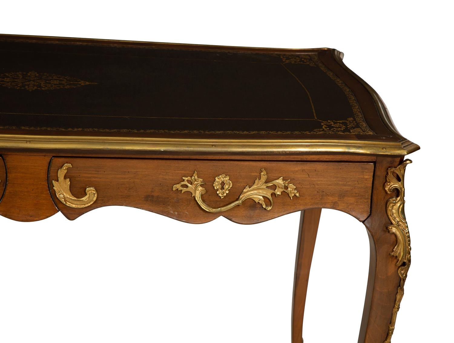 A Louis XV Style Gilt Metal Mounted Walnut Bureau Plat