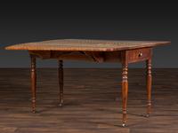 A Late Federal Figured Birch Drop Leaf Dining Table