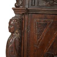 An Italian Carved Walnut Cabinet on Stand