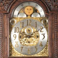 A Renaissance Revival Carved Oak Tall Case Clock