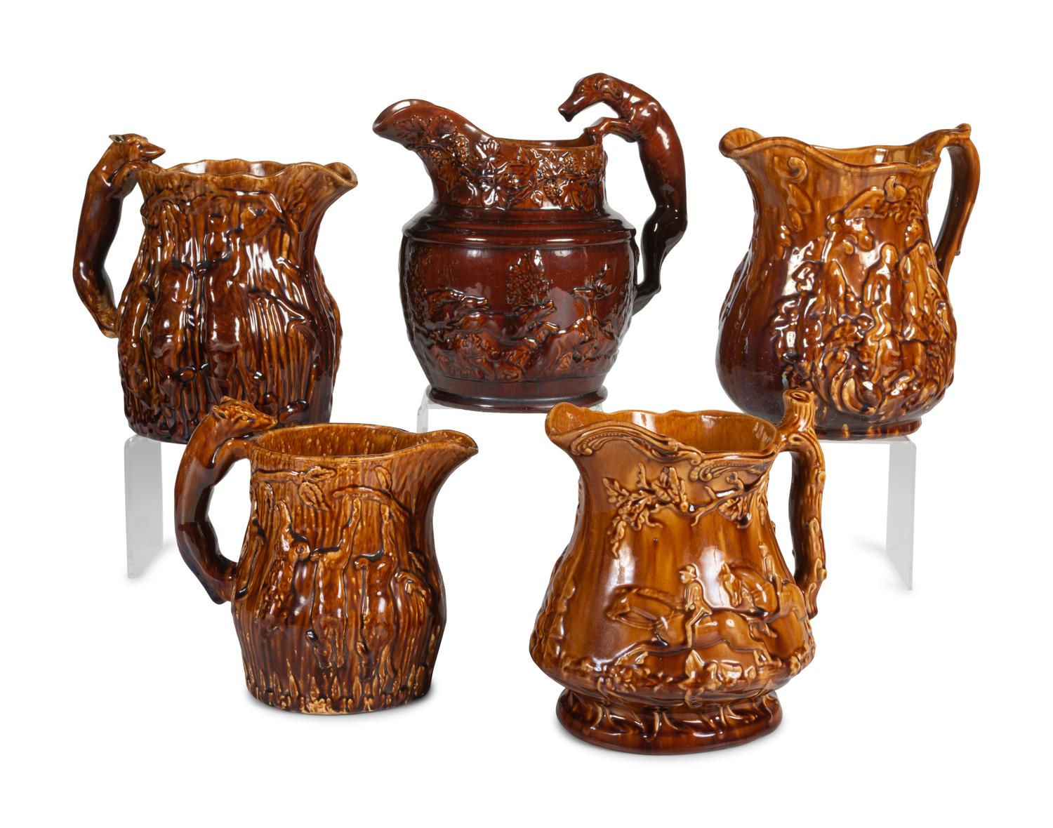 Five Rockingham Glaze Water Pitchers
