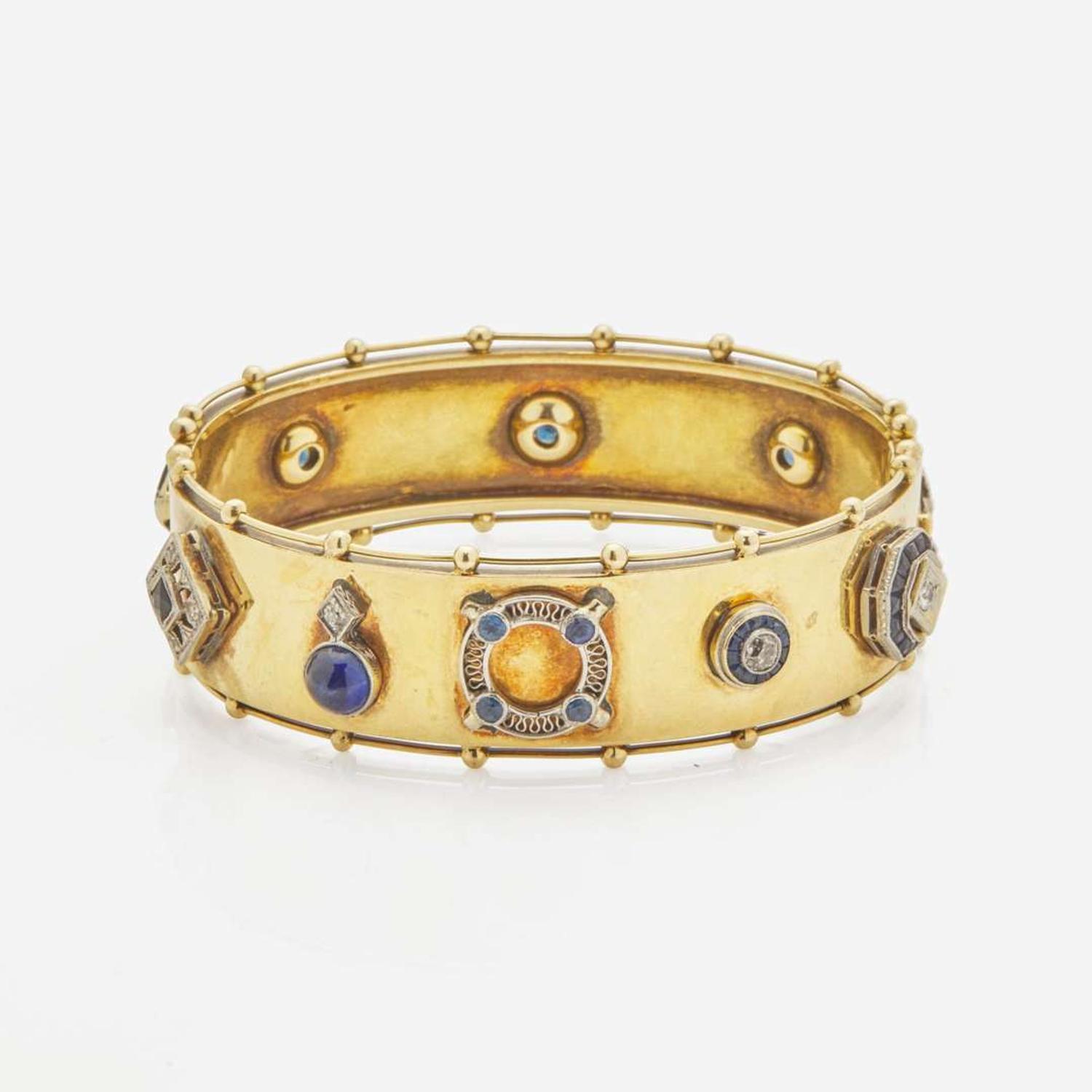 An Antique Yellow Gold Bangle Bracelet with Applique Charms