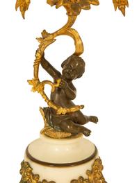 A Pair of Gilt and Patinated Bronze Figural Three-Light Candelabra