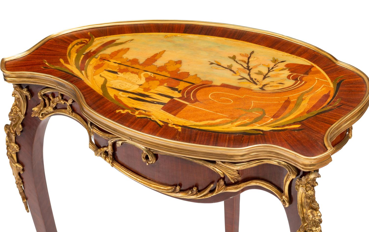 A Louis XV Style Gilt Bronze Mounted Marquetry Table