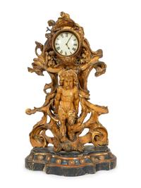 A Continental Carved, Painted and Parcel-Gilt Figural Clock
