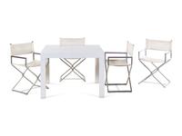 A Set of Four Campaign Style Chairs in the Style of Milo Baughman