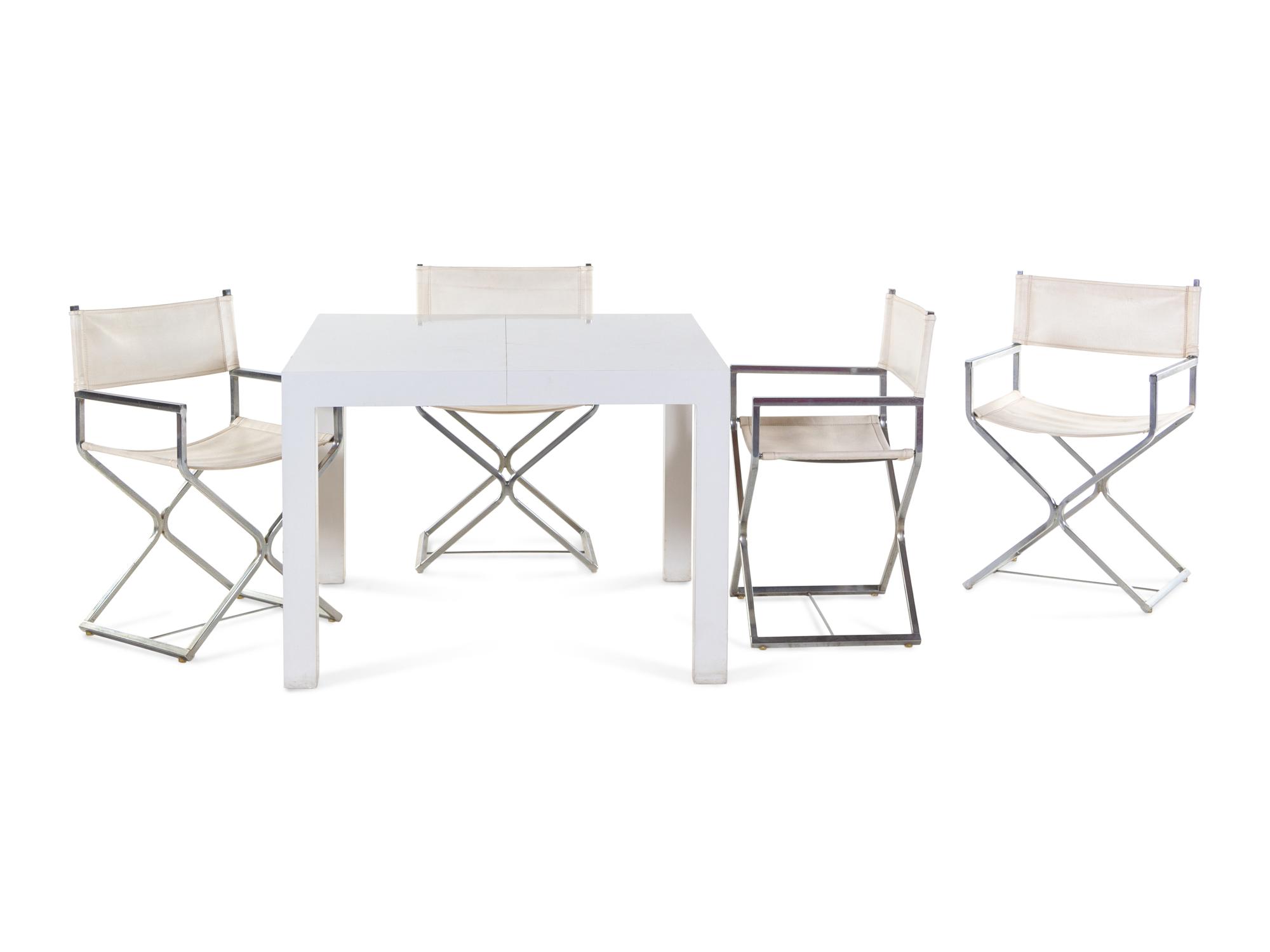 A Set of Four Campaign Style Chairs in the Style of Milo Baughman