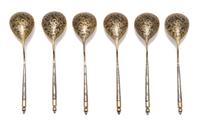 A Set of Six Niello Silver-Gilt Teaspoons, Mark of S. Stroganov, assay mark of Andrey Kovalsky, Moscow, 1846, each having a spherical f