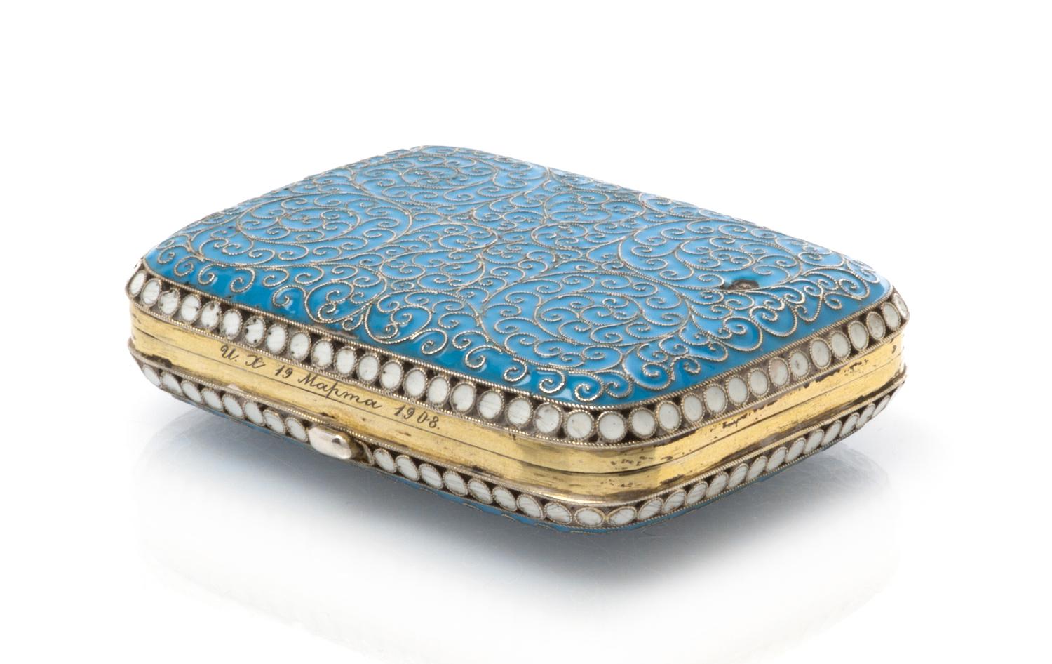 A Russian Enameled Silver Box, Moscow, late 19th century, the case with a light blue enameled ground and filigree scrolls throughout.