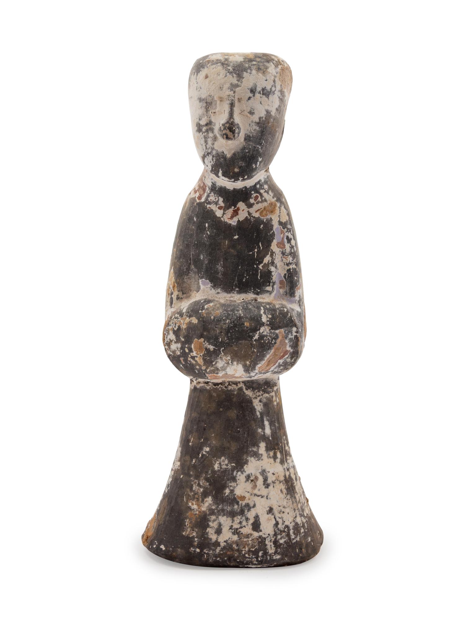 A Chinese Pottery Figure of a Female Attandant