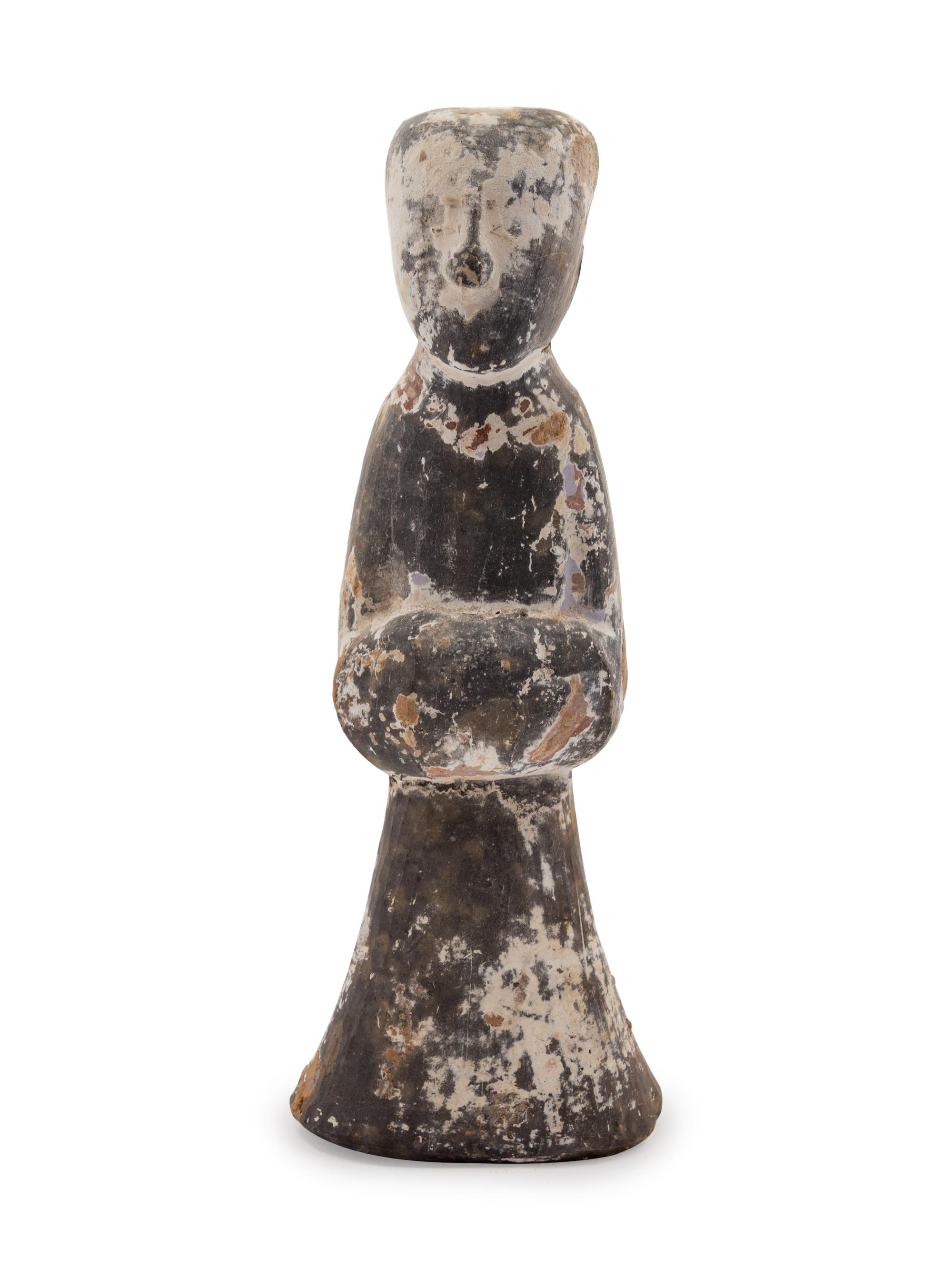 A Chinese Pottery Figure of a Female Attandant
