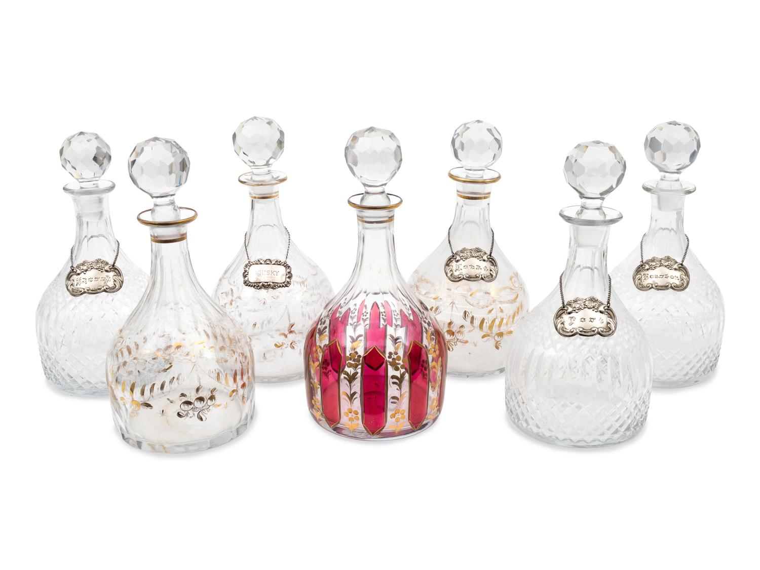 A Group of Seven Large Glass Decanters — 19TH CENTURY