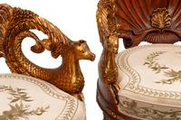 A Pair of Grotto Style Parcel Gilt Carved Walnut Armchairs