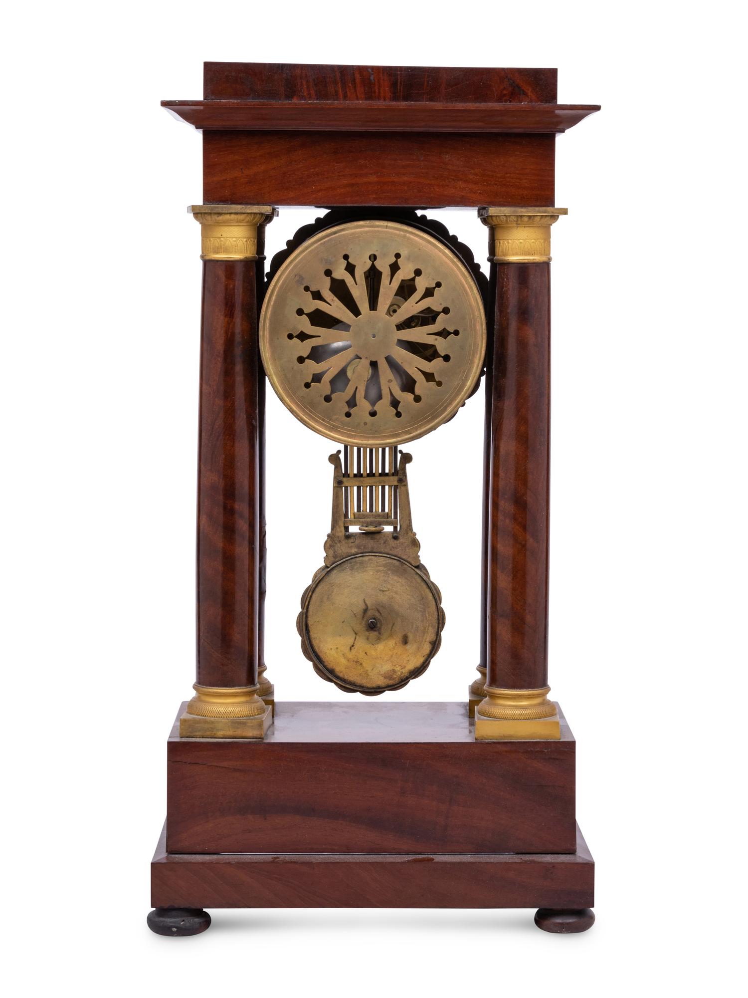 A Charles X Gilt Bronze Mounted Mahogany Portico Clock