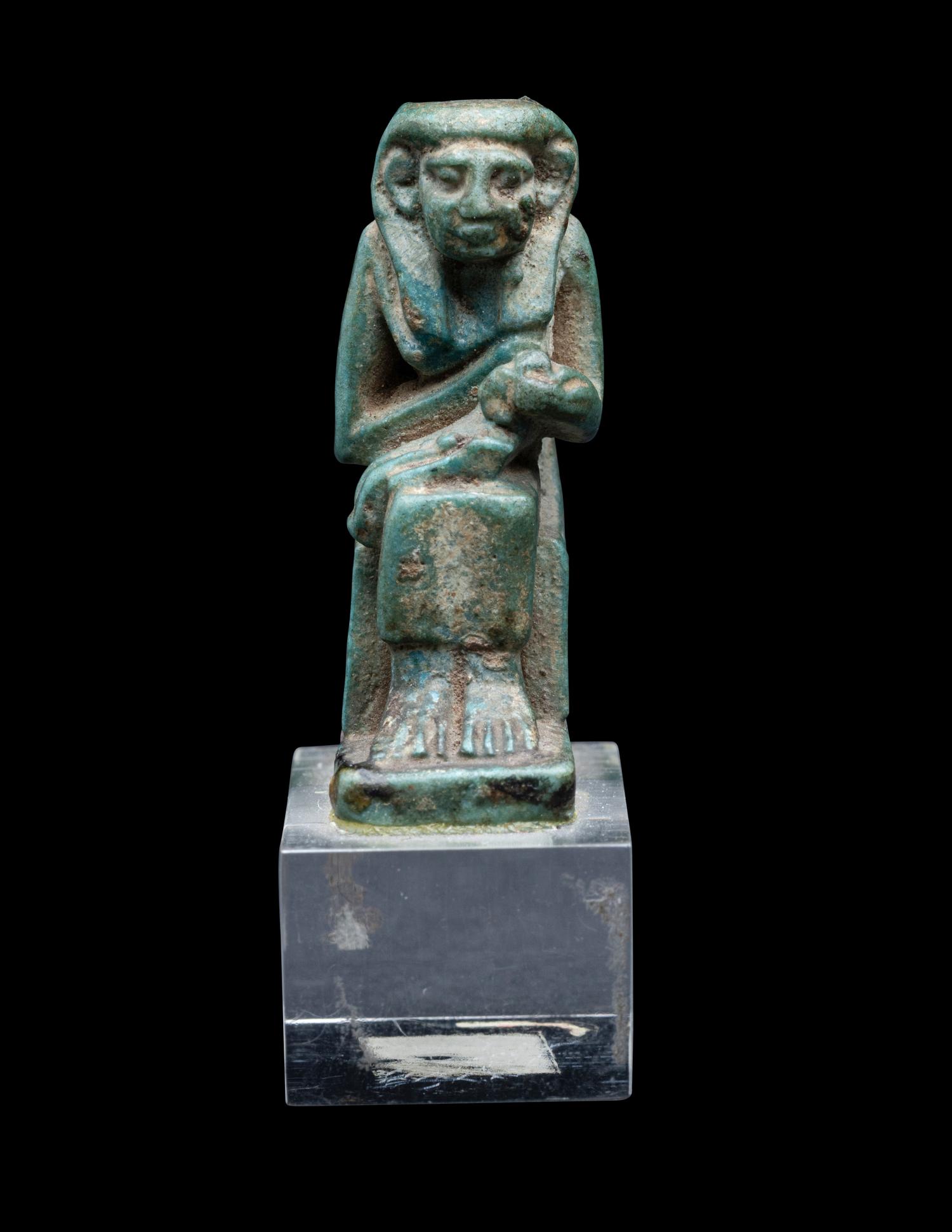 An Egyptian Faience Isis Nursing Horus