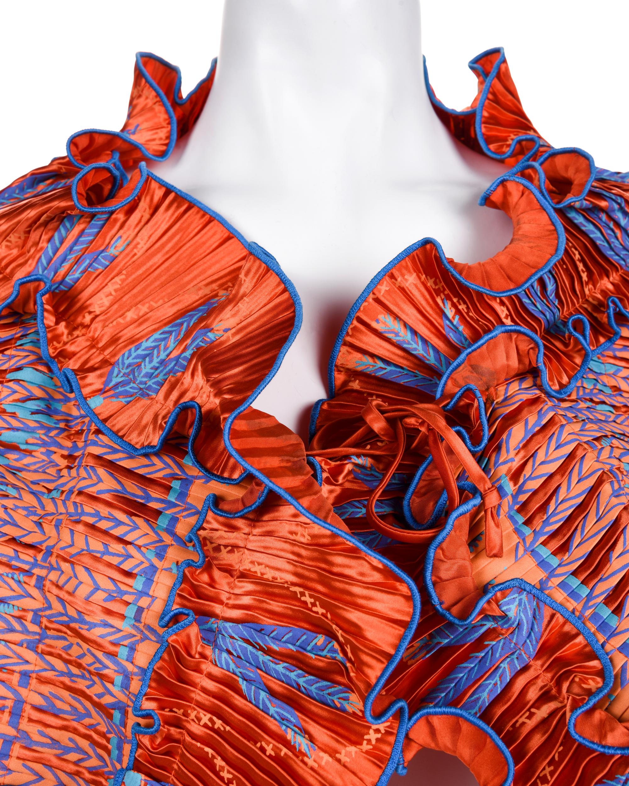 Three Pleated Items: One Zandra Rhodes Bolero and Dress, and One Mary McFadden Dress with Belt, 1980s
