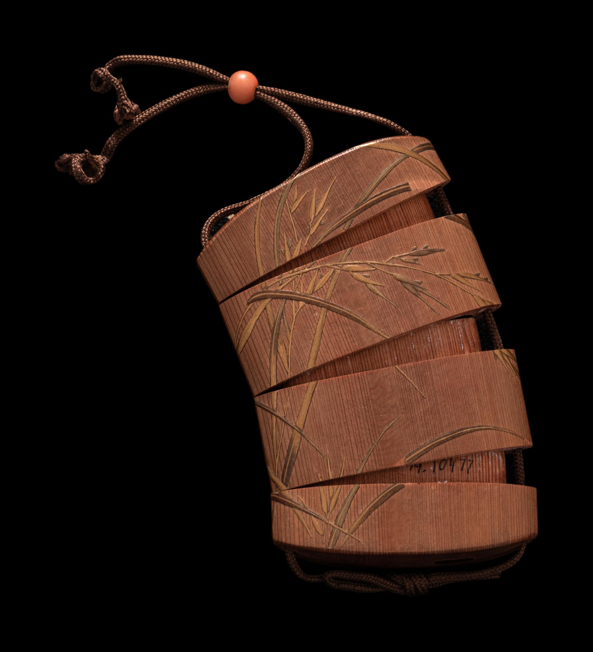 A Japanese Gold Decorated Wood Three-Case Inro