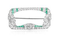 A Platinum, Diamond, and Emerald Brooch, 4.60 dwts.