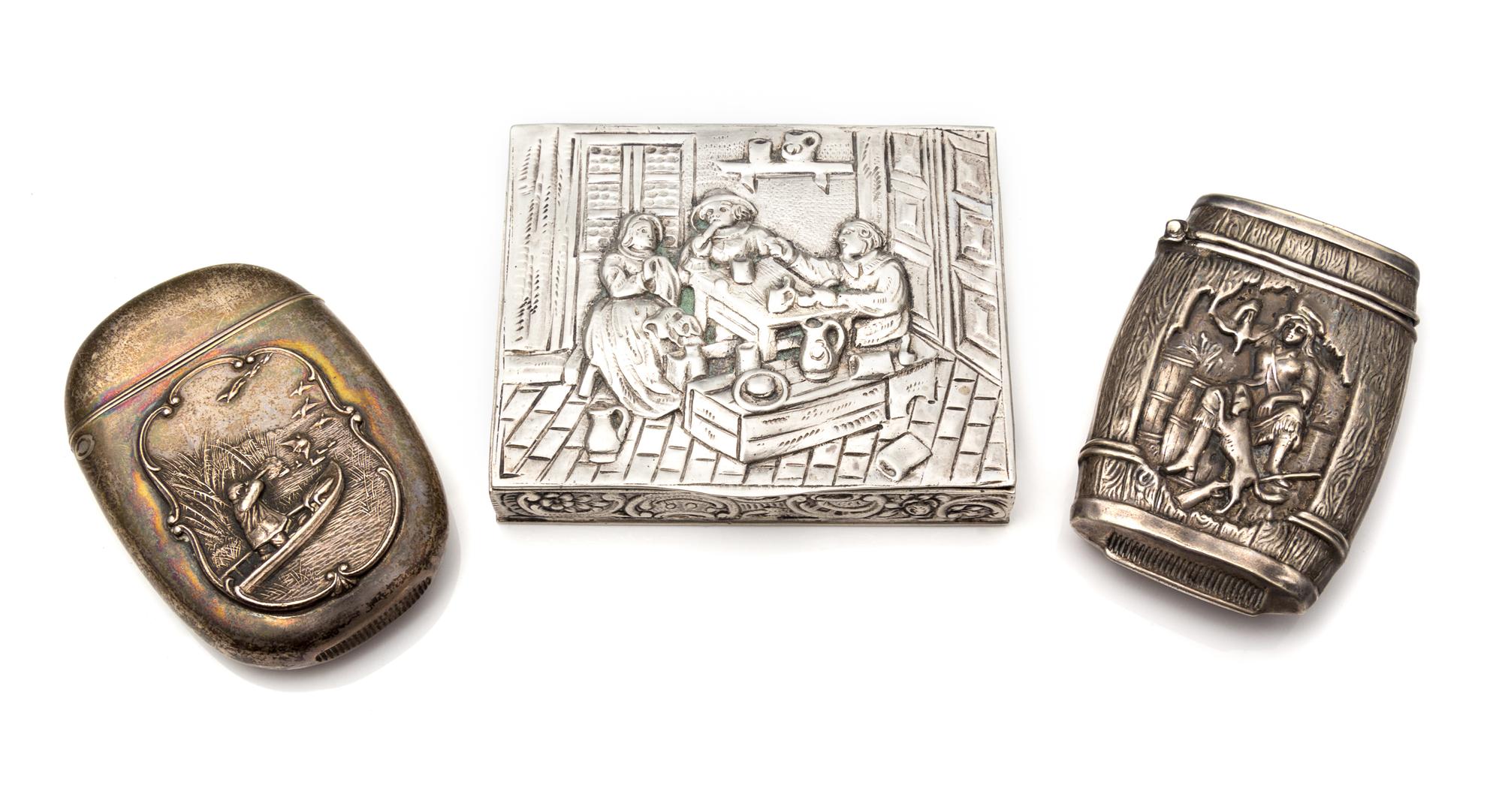 A Collection of Three Silver Cases, Various Makers, comprising a German snuff box having a lid depicting a tavern scene; an American co