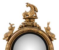 A Regency Part Ebonized Giltwood Convex Mirror