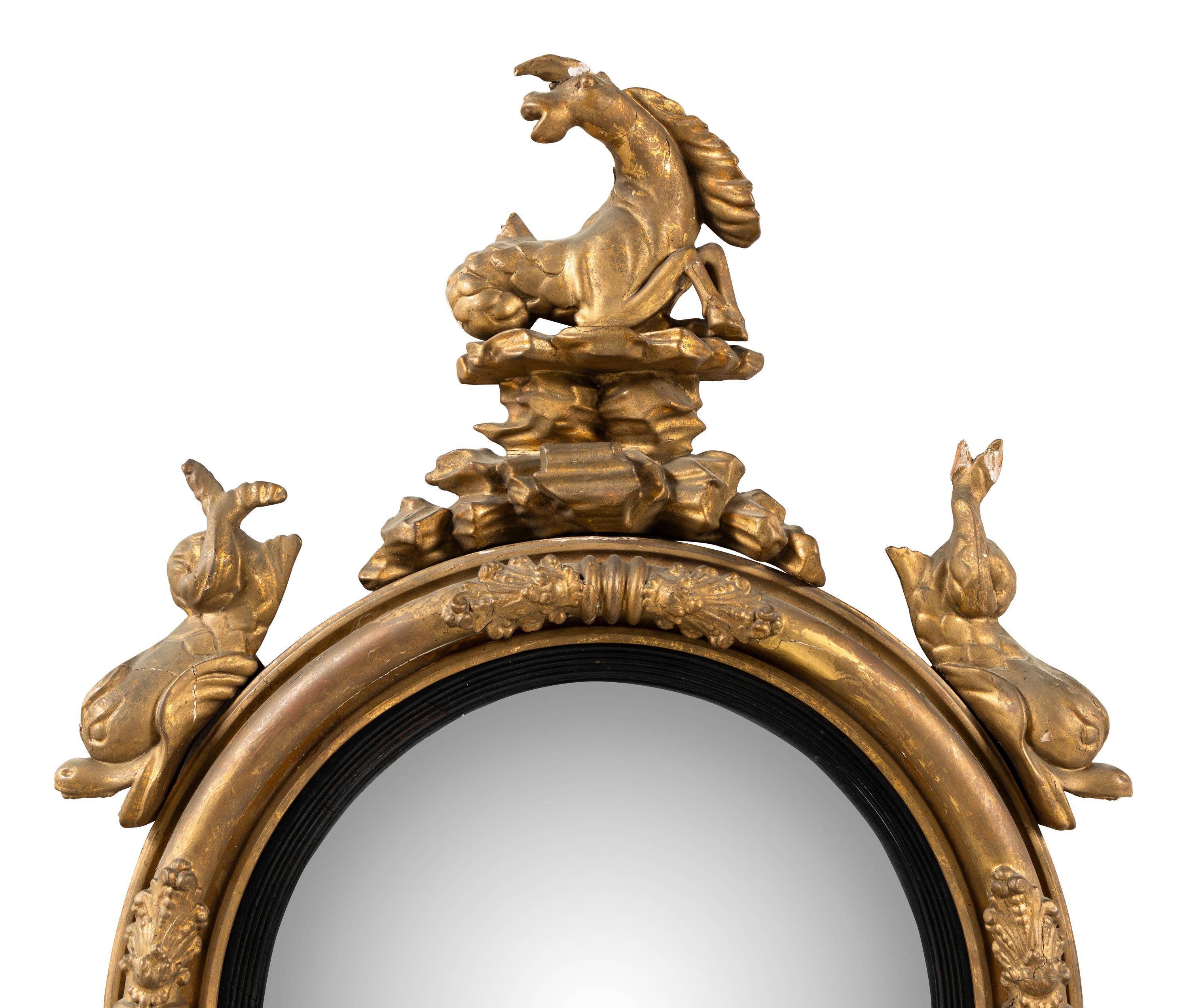 A Regency Part Ebonized Giltwood Convex Mirror