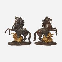 After Guillaume Coustou (French, 1677-1746) A Pair of Gilt and Patinated Bronze Models of the Marly Horses, 19th century