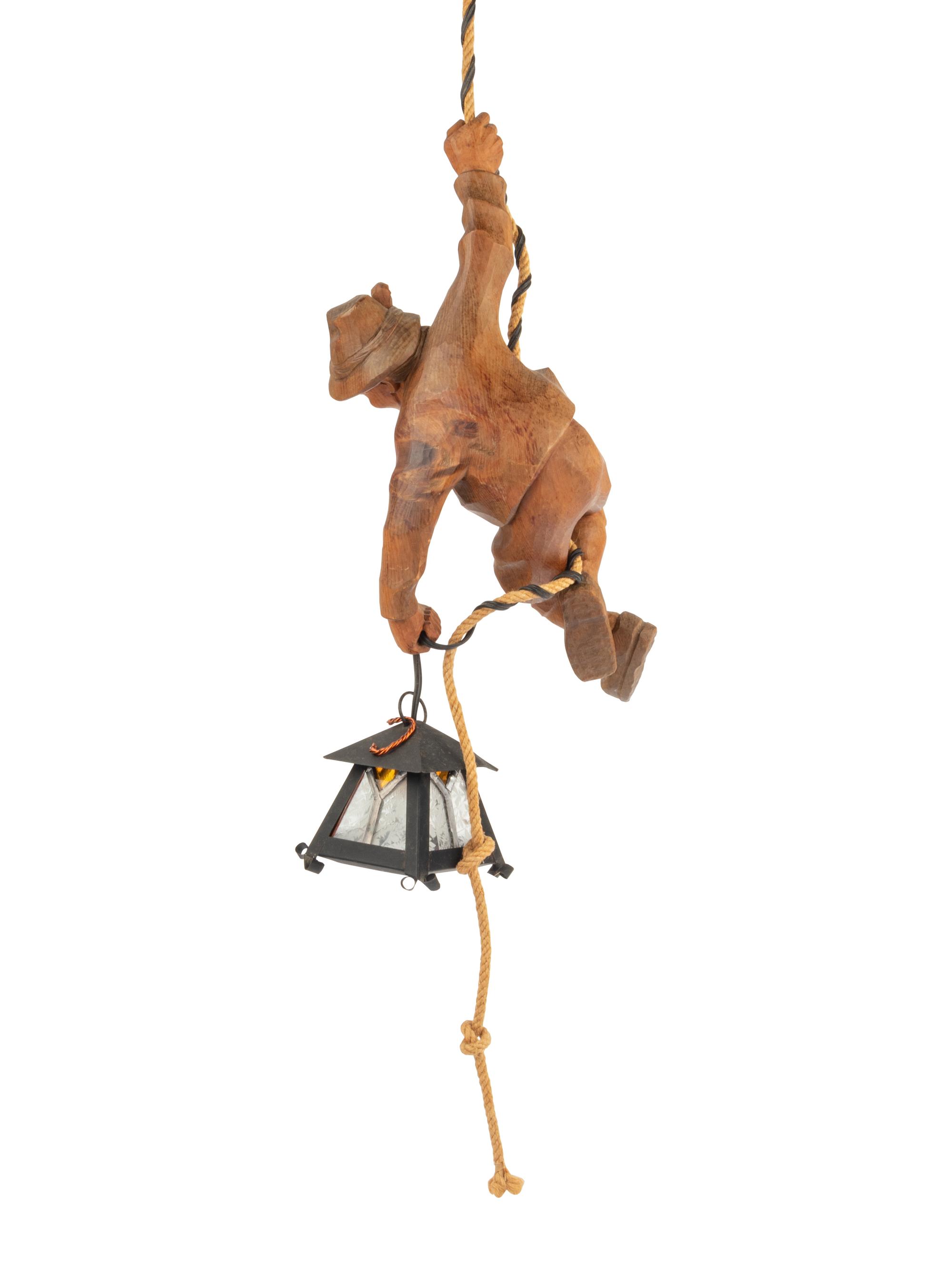 A Black Forest Carved Lindenwood 'Climber' Lamp