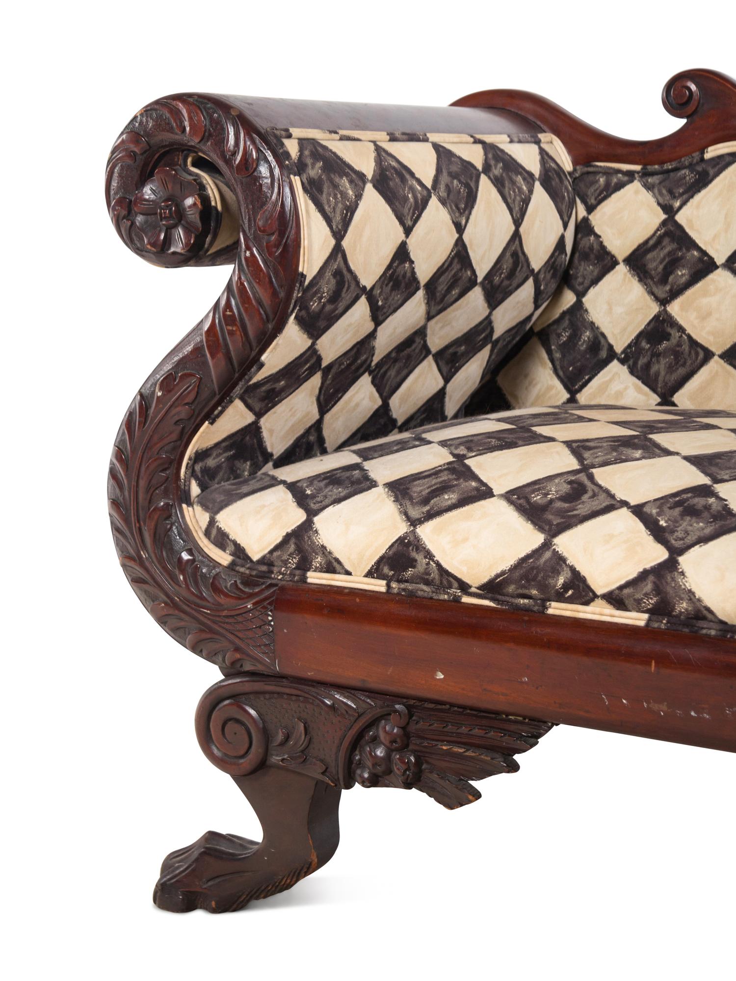 A Classical Carved and Figured Mahogany Settee