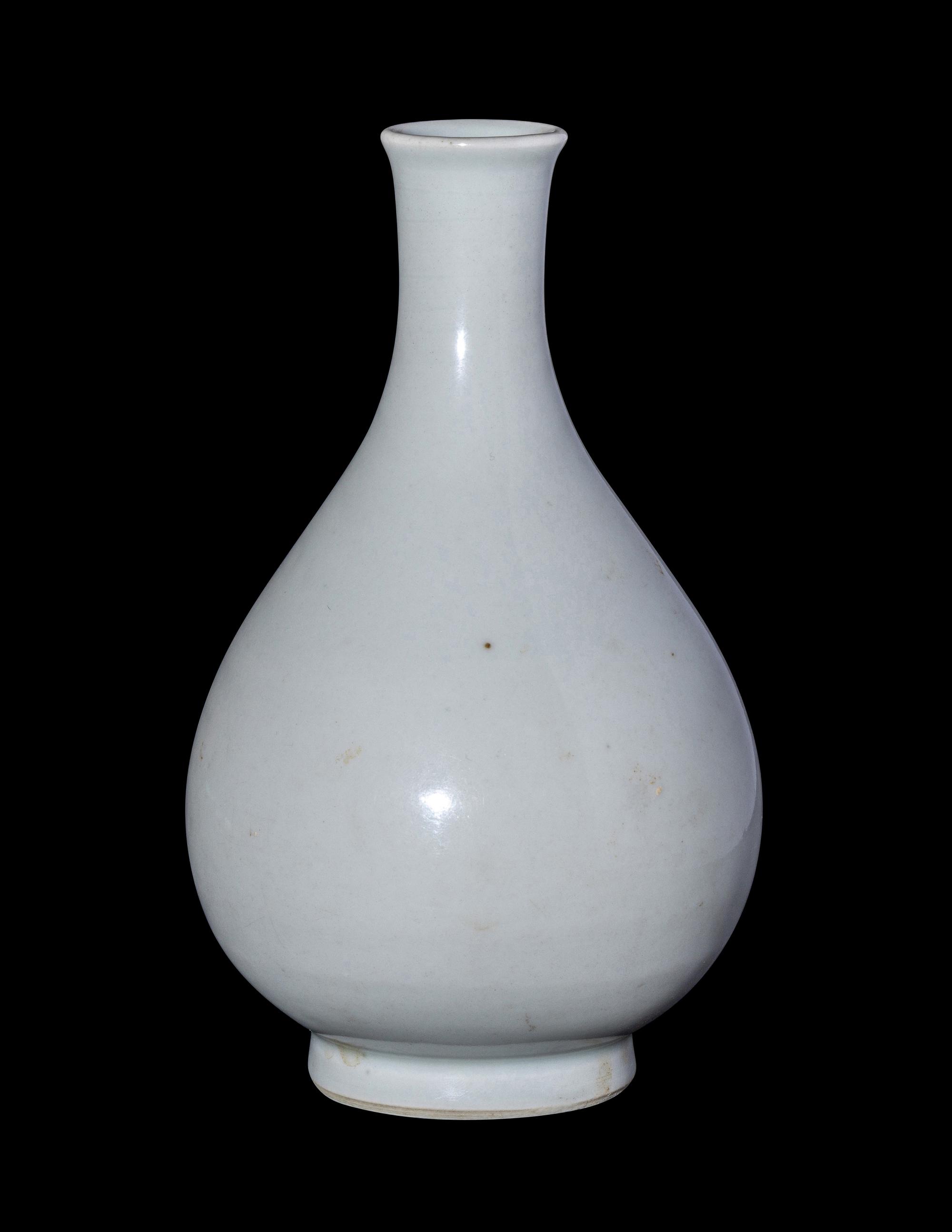 A Chinese Carved White Glazed Porcelain Bottle Vase
