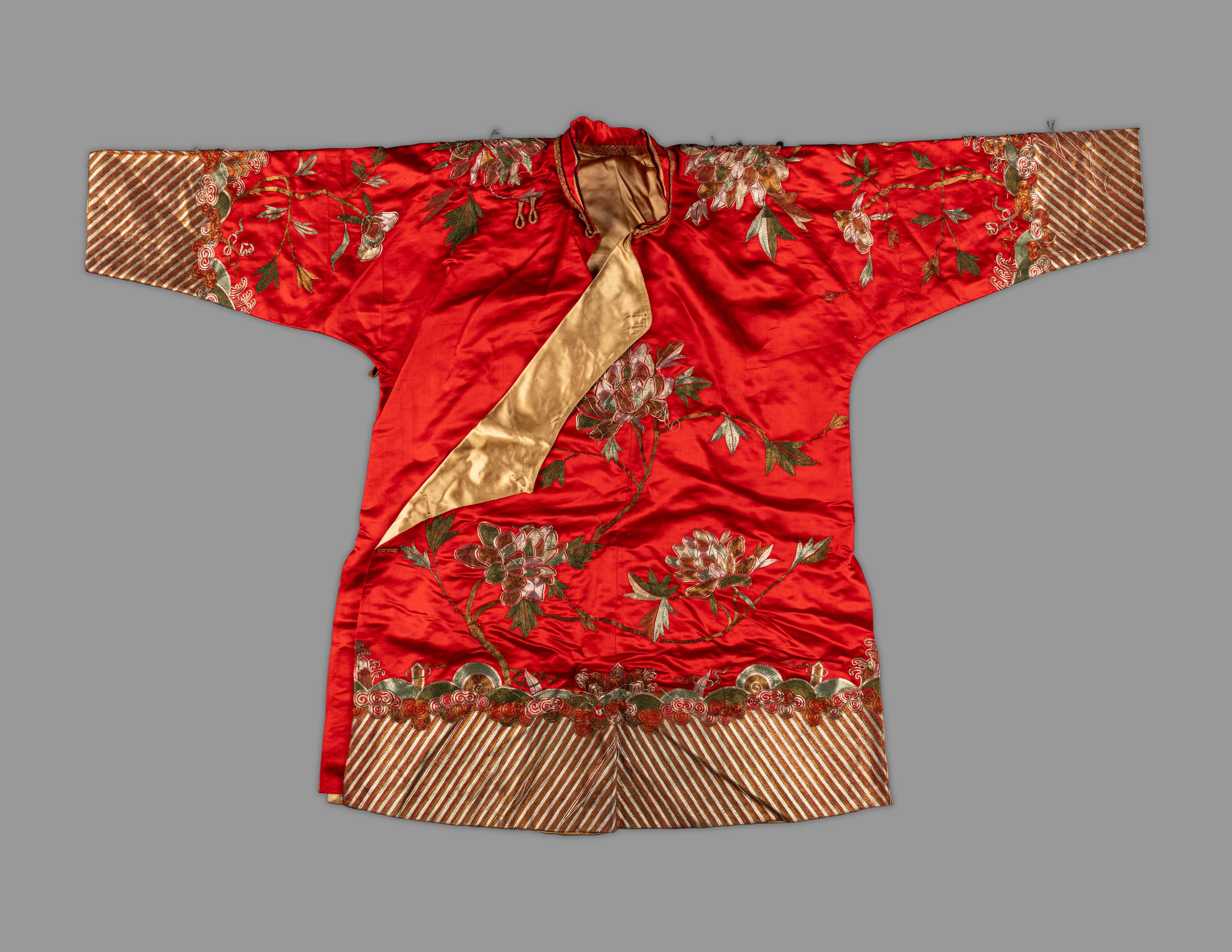 A Chinese Red Ground Embroidered Silk Jacket
