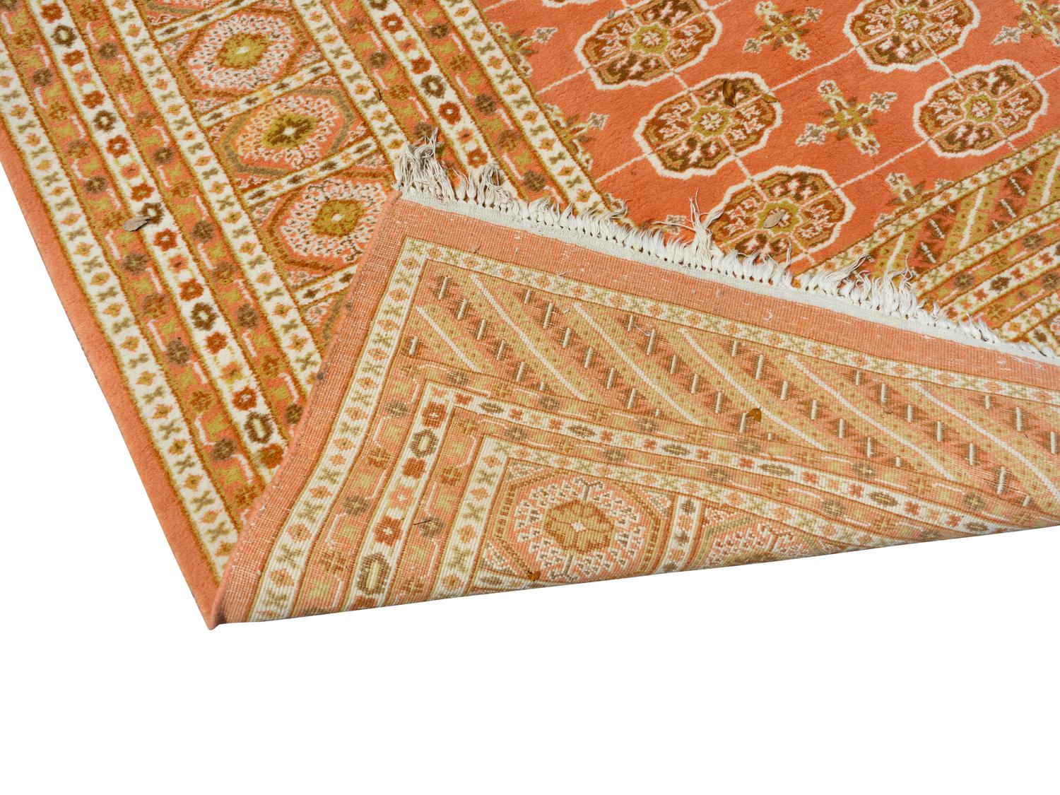A Pakistani Bokhara Wool Rug — 20TH CENTURY