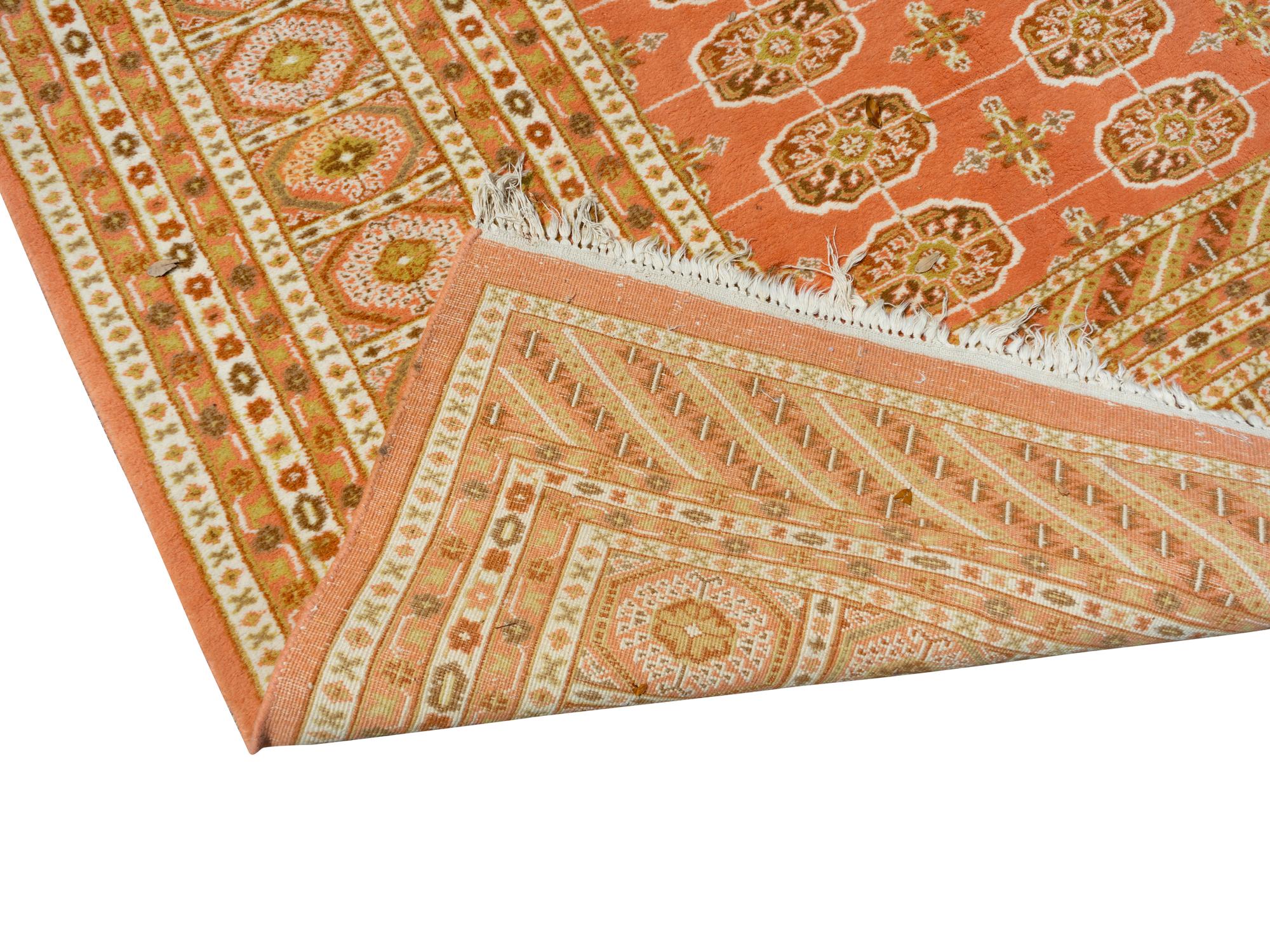 A Pakistani Bokhara Wool Rug — 20TH CENTURY