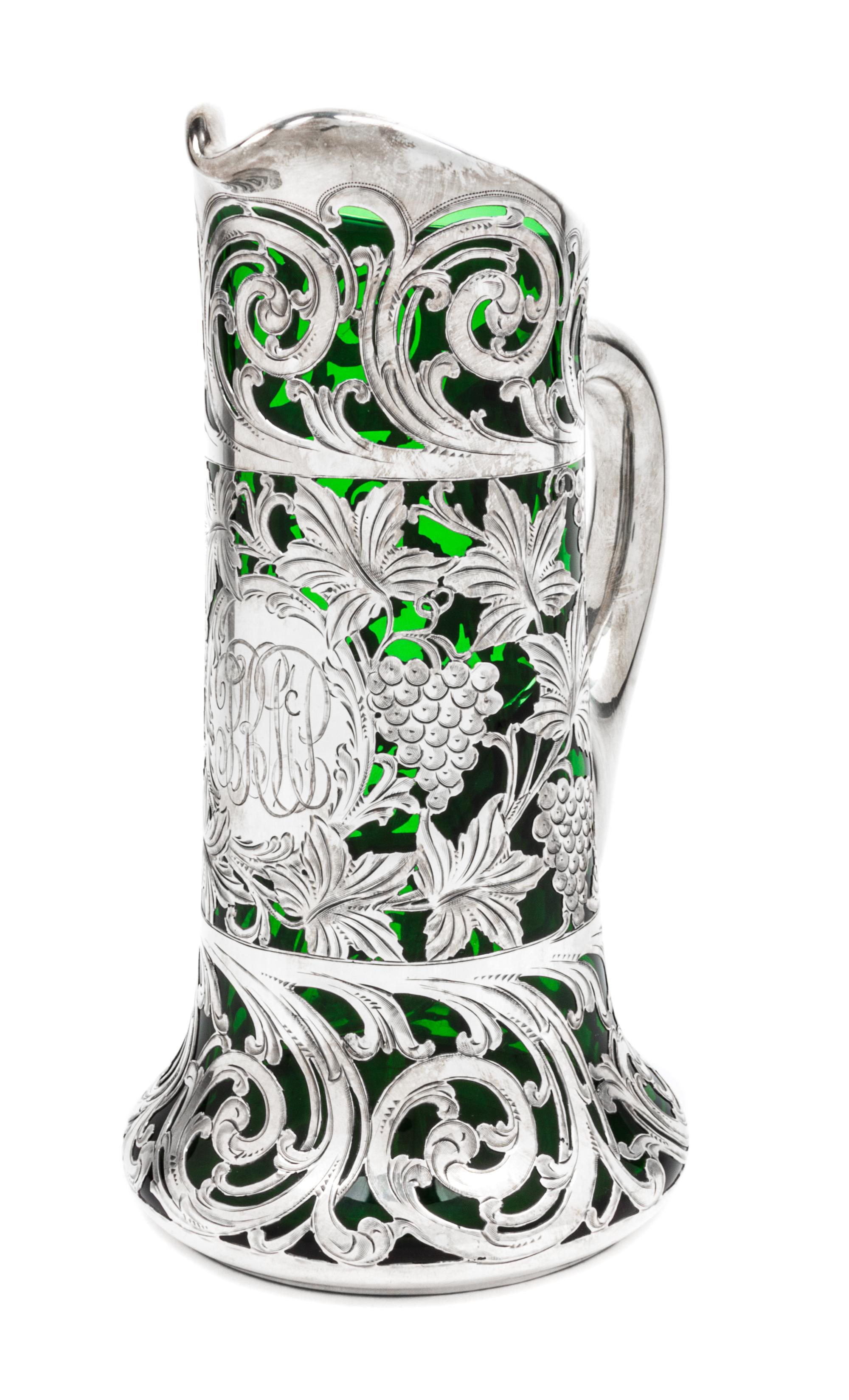 A Silver Overlay Glass Pitcher Height 9 1/8 inches.