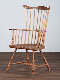 A Volute and Scroll Carved and Reel Turned Windsor Armchair
