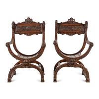 A Pair of Italian Carved Walnut Savonarola Chairs