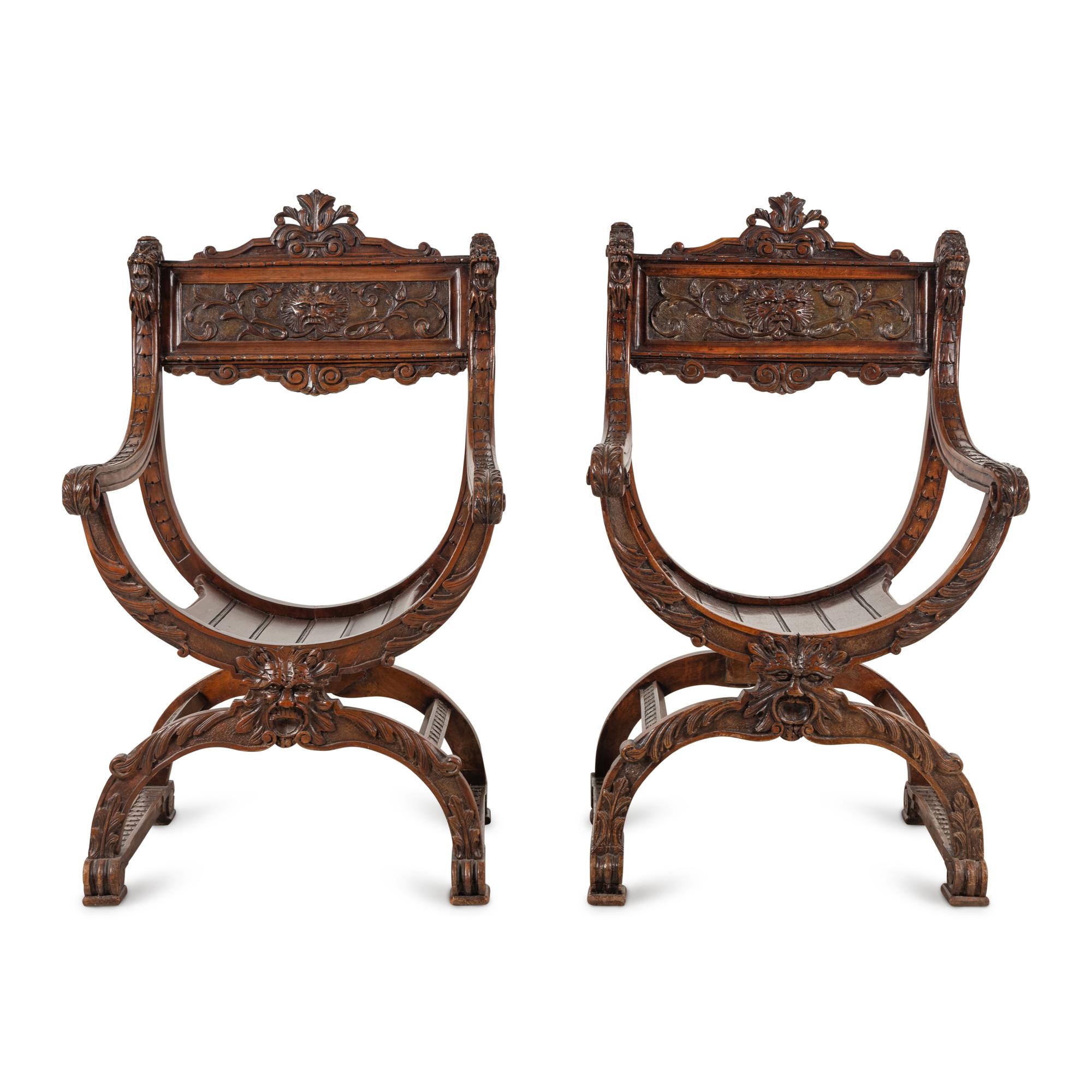 A Pair of Italian Carved Walnut Savonarola Chairs