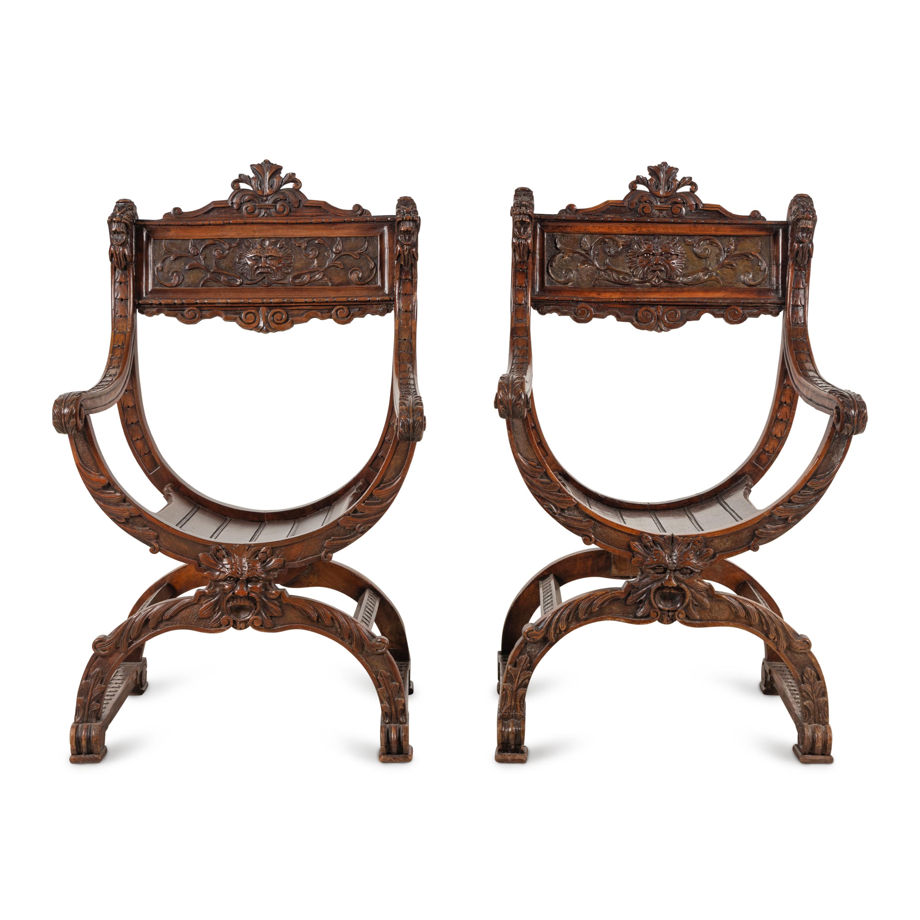 A Pair of Italian Carved Walnut Savonarola Chairs