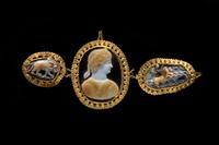 A Trio of Gold-mounted Sardonyx Cameos featuring Nero